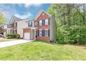 Charming two-story brick home with a well-maintained lawn and attached garage at 6252 Shenfield Ln, Union City, GA 30291