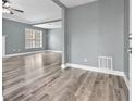 Bright living room featuring stylish floors, fresh paint, and ample natural light at 628 Warren Ave, Scottdale, GA 30079