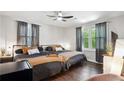 Bright bedroom with two beds, hardwood floors, and ample natural light at 877 Lee Andrews Se Ave, Atlanta, GA 30315