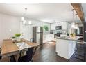Bright kitchen with stainless appliances, white cabinetry, and a breakfast bar at 877 Lee Andrews Se Ave, Atlanta, GA 30315
