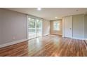 Bright bedroom with wood floors, large sliding glass door leading to deck, and closet at 4309 Gilbert Pl, Forest Park, GA 30297