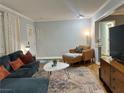 Cozy living room featuring a plush couch, stylish furnishings, and warm hardwood floors at 2447 Hillside Ave, Decatur, GA 30032