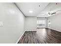 Bright and airy living room with luxury vinyl plank flooring and modern ceiling fan at 1250 Parkwood Circle Se # 1110, Atlanta, GA 30339