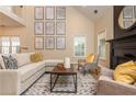 Bright living room with vaulted ceiling, modern fireplace, and stylish decor at 2918 Arbor Creek Ln, Atlanta, GA 30340
