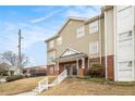View of two-story townhouse with brick accents and lawn at 277 Ralph David Abernathy Blvd, Atlanta, GA 30312