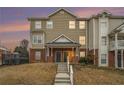 Inviting two-story townhouse with charming brick accents at sunset at 277 Ralph David Abernathy Blvd, Atlanta, GA 30312