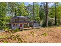 Charming two-story home with a double door garage, nestled in a lush, wooded lot at 4232 Rue Saint Dominique, Stone Mountain, GA 30083