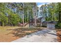 Charming two-story home with a double door garage, nestled in a lush, wooded lot at 4232 Rue Saint Dominique, Stone Mountain, GA 30083