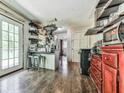 Functional kitchen with stainless steel appliances, dark wood floors, and a convenient breakfast bar at 1527 Keeter Rd, Canton, GA 30114