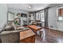 Comfortable living room featuring hardwood floors, neutral walls, and natural light from the window at 1527 Keeter Rd, Canton, GA 30114