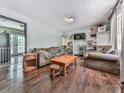 Cozy living room with hardwood floors, comfortable seating, and shelves for storage, offering a relaxing space at 1527 Keeter Rd, Canton, GA 30114