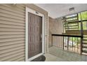 Apartment front door with a doormat, and a view of the exterior stairway at 110 Barrington Hills Dr # 110, Atlanta, GA 30350