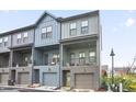 Stylish townhome featuring contemporary architecture, private balconies, and an attached garage at 200 Chestnut Cir, Atlanta, GA 30342