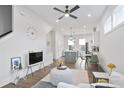 Open concept living space with hardwood floors, modern decor, and a view of the kitchen at 200 Chestnut Cir, Atlanta, GA 30342