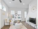 Bright living room boasts hardwood floors, plentiful natural light, and modern decor at 200 Chestnut Cir, Atlanta, GA 30342