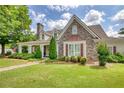 Charming stone and siding home with well-manicured lawn and mature landscaping at 3818 Bay Forest Way, Loganville, GA 30052