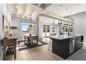 Modern kitchen with stainless steel appliances and island with breakfast bar at 805 Peachtree Ne St # 220, Atlanta, GA 30308