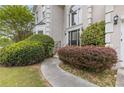 Close up of front entrance and manicured yard with sidewalk leading up to a detailed front door at 861 Southland Pass, Stone Mountain, GA 30087