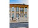 Beautiful two-story brick building features large windows, balconies, and detailed brickwork at 140 Rolison Way, Fayetteville, GA 30214