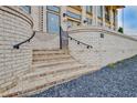 Elegant brick stairs lead to the entrance of this well-designed building with dark gravel and light brick at 140 Rolison Way, Fayetteville, GA 30214