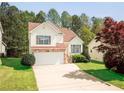 Beautiful two-story home highlighting stone accents, a two-car garage, and a green lawn at 4032 Robin Cir, College Park, GA 30349