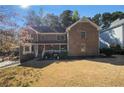 Beautiful two-story brick home with a well-maintained lawn and inviting front porch at 5000 Bainbridge Sw Ct, Lilburn, GA 30047