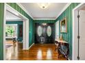 Elegant foyer with hardwood floors, a decorative double door, and stylish accents at 705 W Ponce De Leon Ave, Decatur, GA 30030