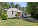 Charming single-story home featuring a lush green lawn and freshly painted exterior at 1079 Pinedale Se Dr, Smyrna, GA 30080