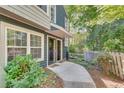 Charming entryway features a walkway, privacy fence, and lush greenery at 1426 N Crossing Ne Dr, Atlanta, GA 30329