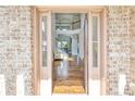 Inviting foyer showcasing hardwood floors, a staircase with iron railings, and an open view of the home's interior at 1993 Side Branch Way, Lawrenceville, GA 30045