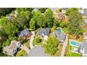 Aerial view showcasing the home's location within a lush, green, and established neighborhood at 3105 Birchton St, Johns Creek, GA 30022