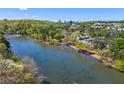 Breathtaking aerial shot of a community along a river with city skyline at 1021 Riverbend Club Se Dr, Atlanta, GA 30339