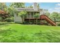 Expansive backyard with lush lawn, deck, and staircase, perfect for outdoor enjoyment at 3320 Woodleaf Way, Marietta, GA 30062