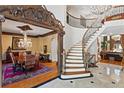 Spacious foyer with grand staircase that leads to the second floor at 2120 Blackheath Trce, Alpharetta, GA 30005