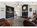 Stylish living room showcasing a modern fireplace, hardwood floors, and comfortable seating at 95 Graystone Dr, Covington, GA 30014