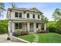 Beautiful two-story home featuring stone accents, black-framed windows, and a covered front porch at 2193 Virginia Ne Pl, Atlanta, GA 30305
