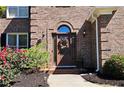 Welcoming front entrance showcasing a brick facade, decorative wreath, and well-maintained landscaping at 2227 Austin Lake Se Dr, Smyrna, GA 30082