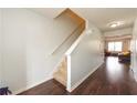 Hallway features hardwood floors, staircase, and neutral paint tones at 275 Fern Crest Dr, Lawrenceville, GA 30046