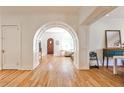 Inviting entryway with hardwood floors, arched doorway, and natural light, creating a warm and welcoming ambiance at 272 Rumson Ne Rd, Atlanta, GA 30305