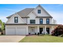 Beautifully designed two-story home with a manicured lawn and a welcoming front porch at 541 Lombard St, Marietta, GA 30064