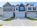 New townhome exterior boasts varied architectural styles and attached two-car garages at 2674 Ne Almand Ne Ln, Conyers, GA 30013