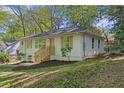 Stylish front yard with newly installed wooden stairs and nice greenery at 1346 Wichita Sw Dr, Atlanta, GA 30311
