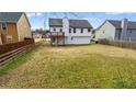 Expansive backyard featuring a raised deck and ample green space, perfect for outdoor activities and relaxation at 3094 Jonesboro St, Ellenwood, GA 30294