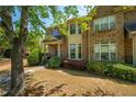 Lovely two-story brick home with a well-maintained lawn and mature trees at 6150 Thorncrest Dr, Tucker, GA 30084