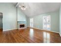 Well-lit living room with hardwood floors, fireplace, and bright, neutral paint at 1214 Defoors Nw Ct # 1A, Atlanta, GA 30318