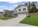 Attractive two-story home with a two-car garage and well-maintained lawn at 529 Lanier Way, Temple, GA 30179