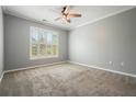 Spacious bedroom with neutral carpet, ceiling fan, and shuttered windows offering ample natural light at 10 Perimeter Summit Ne Blvd # 2207, Brookhaven, GA 30319