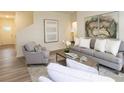 Inviting living room with plush seating, stylish decor, and plenty of natural light streaming throughout the space at 2688 Ne Almand Ln, Conyers, GA 30013