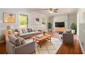 Cozy living room featuring hardwood floors, bright windows and neutral paint at 2914 Stanton Se Rd, Conyers, GA 30094