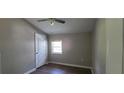 Cozy bedroom with natural light from the window and wood-look floors at 2917 Joe Jerkins Blvd, Austell, GA 30106
